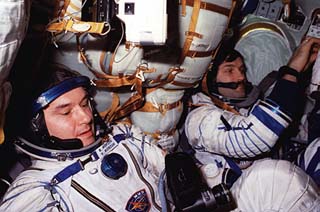 Mir-22 commander Valeri Korzun (left) and Alexander Kaleri (right) in the Soyuz seats.